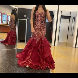 A brand new never worn prom dress with ruffles and lace on the bottom.